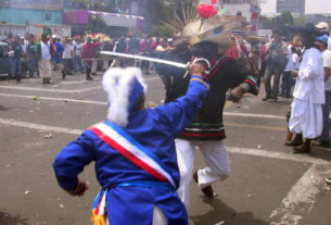 There's a skirmish at every intersection for the annual Cinco de Mayo parade in Mexico City. Costumed residents reenact scenes from the Battle of Puebla, and smoke in the air comes from simulated musket fire. © Donald W. Miles, 2009