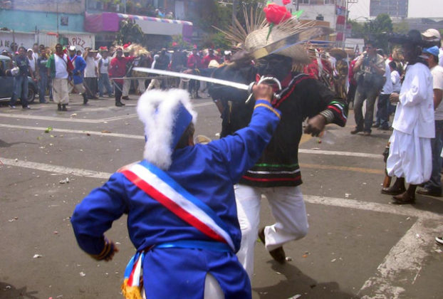 There's a skirmish at every intersection for the annual Cinco de Mayo parade in Mexico City. Costumed residents reenact scenes from the Battle of Puebla, and smoke in the air comes from simulated musket fire. © Donald W. Miles, 2009