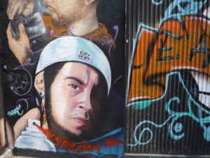 A local homeboy rendered in photo-realism, a detail from one of the graffiti murals on the Estadio Azteca (Aztec Stadium) in Mexico City. © Anthony Wright, 2009