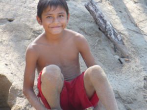 A boy plays in the sand at La Peñita de Jaltemba on the coast of the Mexican Pacific. The town and its beach are popular with Mexican families as well as with foreign tourists. © Christina Stobbs, 2009