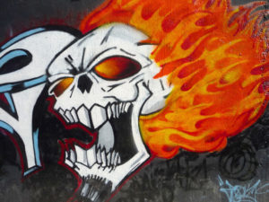This rendition of a fiery skull is part of the sanctioned wall art that decorates educational institution in Mexico City. © Anthony Wright, 2009