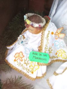 The Child of the Butterflies is an image of Baby Jesus seen in a Oaxaca market © Tara Lowry, 2014