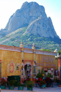 A Mexican handicraft shop in the 16th century colonial town of Bernal, Querétaro sits in the shadow of La Peña de Bernal. The magnificent rock formation is one of the largest peñas in the world. © Jane Ammeson 2009