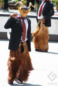 Performing the Dance of the Devils from Juxtrahuaca, men wear dark business suits, horned masks and the furry leggings of a goat. This is a part of Oaxaca's celebrated Guelaguetza festivities. © Oscar Encines, 2008