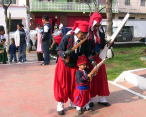 Three generations dress as Zouaves, the French infantry regiments serving abroad in the 19th and 20th centuries. They are Mexico City residents taking part in Cinco de Mayo festivities in the capital. © Donald W. Miles, 2009