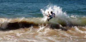 A skimboard rider displays some of the skills as surfers at Melaque on Mexico's Pacific coast. © Gerry Soroka, 2010