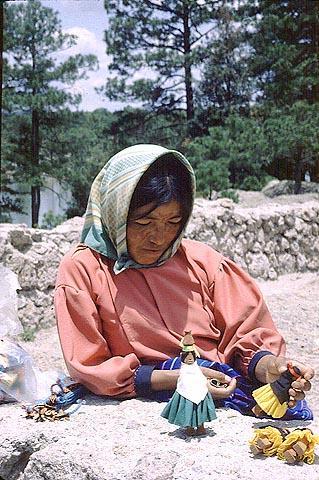With tourism increasing, the Taramuhara women of the Copper Canyon make dolls and sell them to tourists at train stops. © Geri Anderson 2001.