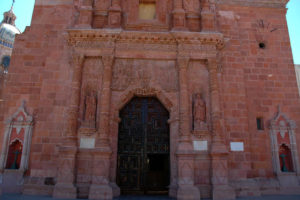 The Sanctuary of Our Lady of Guadalupe in Zacatecas dates back to the early 1700s. Intricate Baroque style carvings seen here on the exterior walls are made from immersing limestone into water for several weeks until it becomes so soft that it could be carved with a pencil. Then, as it dries in the hot sun, it becomes a hard stone again. © Jane Ammeson, 2009