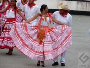 Women from the coast of the Tehuantepec Isthmus wear embroidered blouses and full, lacy skirts. The men wear white. These dancers perform during Oaxaca's annual Guelaguetza celebration in July. © Oscar Encines, 2008