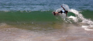 Skilled as many champions, a young Mexican skimboarder catches a wave on the shore of Melaque, Jalisco. © Gerry Soroka, 2010