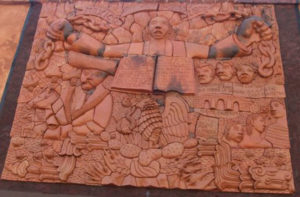 Surrounded by personages from Mexico's history, Miguel Hidalgo breaks the chains of Spanish rule and declares the end of slavery in 'Independence,' a terracotta relief mural by Mexican artist Efren Gonzalez. © Rob Mohr, 2010