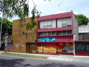 A completed Dhear and Smithe wall art project in Mexico City. Note the untouched work, while regular, ugly graffiti vandalism smear the walls on either side of it. © Anthony Wright, 2009