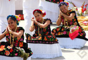 Tehuana women in their elaborate traditional dress. The underskirt is lace while the skirt and bodice are embroidered black velvet. Coins form part of their sumptuous gold jewelry. Their performance is part of the annual Guelaguetza festivities in Oaxaca, held the last two Mondays of July. © Oscar Encines, 2008