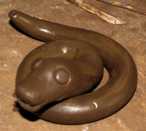 This sneaky snake, having crawled out of the clay at the encouragement of Antonia Cruz Rafael's hands, coils to to strike. The skilled ceramist caries on the artisan traditions of Ocumicho, Michoacan. © Travis Whitehead, 2009