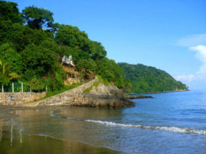 The half-mile long beach of Los Ayala is a palm fringed cove, perfect for swimming with soft, silky gold specked sand, a gradually sloping shoreline and crystal clear waters. © Christina Stobbs, 2009