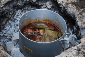 Pork is wrapped in banana leaves, seasoned with ground annatto seeds or achiote, and roasted overnight in an underground oven, called a pib. The oven gives cochinita pipil its name. © Jane Ammeson, 2009