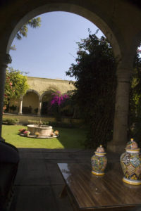 A view of the patio at Mexico's Hacienda Labor de Rivera, surrounded by arched porticos. © John Pint, 2011