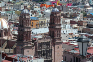 The Churrigueresque style Cathedral with its two peak towers is a colonial treasure built pink cantera stone.