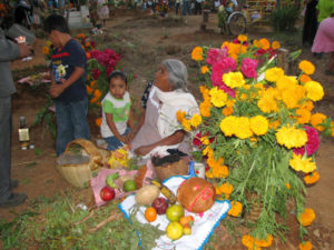There's no generation gap during Day of the Dead celebrations. The young and old gather together, each helping in preparations for the return of departed family members.
