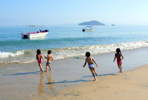 Children frolic on th beach of Mexico's beautiful Jaltemba Bay. © Christina Stobbs, 2011