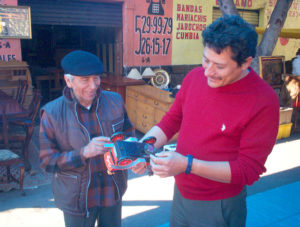 Jose Carlos and Raul share a laugh while testing the workability of a 1960s German wind-up vehicle.