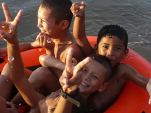 Wet little boys wiggle and giggle as they enjoy the beach at La Peñita de Jaltemba on Mexico's Nayarit Riviera. The people of La Peñita are friendly, warm and openhearted. © Christina Stobbs, 2009