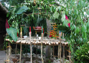 Food is placed on an altar and blessed before being served in Pac Chen, a Mayan jungle village in Quintana Roo. The altar is a part of their traditional Day of the Dead celebration. © Jane Ammeson, 2009