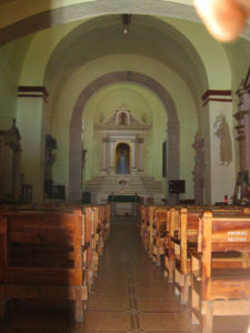 Julia Taylor was able to get a picture of the church interior through the hole in the door. Tis is the San Esteban church in Zacatepex, Morelos. © Julia Taylor, 2008