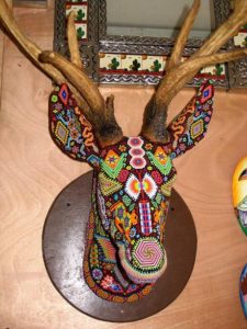 Tamatz Kauyumarie is the sacred blue deer revered by the Huichol people. This masterful sculpture is by artisan-philosophre Kupihu'ute-Itzpapalotl. © Erin Cassin, 2006