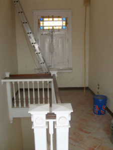 This is the original top floor landing of Mi Pullman, a famous landmark in Chapala. The Mexican art nouveau home was built in 1906 by architect Guillermo de Alba and restored by the author. The only way to get onto the roof was via a ladder. The west facing window was in a terrible state of repair and needed taping up. © Ros Chenery, 2010