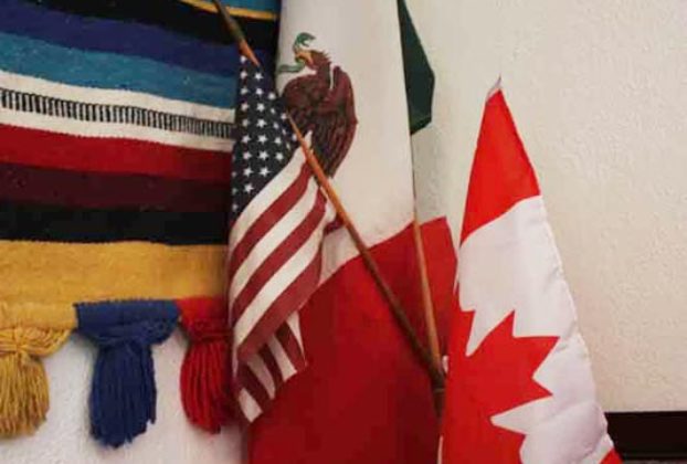 The Mexican, American, and Canadian (the MAC in Liga MAC) flags are on display in the organizations office © Mariah Baumgartle, 2012