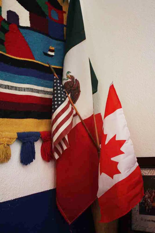 The Mexican, American, and Canadian (the MAC in Liga MAC) flags are on display in the organizations office © Mariah Baumgartle, 2012