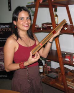 Mrs. Liviere de Ortiz shows an example of the longest regularly produced hand-rolled cigar according to the Guinness Book of World Records