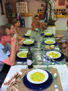 Colorful crema de flor de calabaza (cream of squash blossom soup) followed the quesadilla at Pilar Cabrera's well set Oaxaca table. © Alvin Starkman 2008