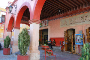 Bernal's centro (downtown, or central district) is filled with shops housed in colonial buildings. Tempting merchandise is displayed in windows, doorways, and beneath the colorful arcades that line the streets. The Querétaro town has been designated a pueblo mágico. © Jane Ammeson 2009