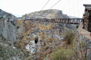 El Puente de Ojuela is a suspension bridge spaning more than 300 meters in Durango, Mexico. It was originally constructed in 1898 and, later, redesigned by Santiago Minguin, a German engineer. It was used to move ore from the mine across the canyon to the village of Ojuela, now in ruins. © Jeffrey B. Bacon, 2011