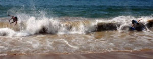 Skilled as many champions, a young Mexican skimboarder rides a wave on the shore of Melaque, Jalisco. © Gerry Soroka, 2010