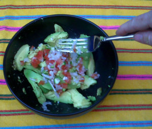 Mix the ingredients together, mashing the avocado with a fork as you do so. © Daniel Wheeler, 2009