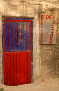 Sand drifted against the door confirms that this shoemaker in Melaque, Jalisco, has closed shop © Gerry Soroka, 2009