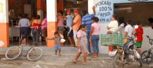 A busy store in Melaque, a Mexico beach towwn, offers "Fish 100% Fresh." © Gerry Soroka, 2009