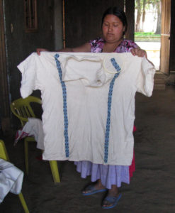Elena Reyes Remigio shows off a men's shirt she's embroidering. The embroidery artisanry of Cocucho, Michoacan, is legendary. © Travis Whitehead, 2009