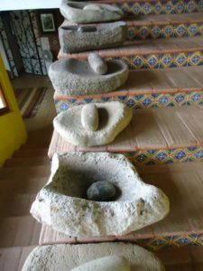 A collection of antique stone metates, or grinding stones, ffrom Mexico © Alvin Starkman, 2011