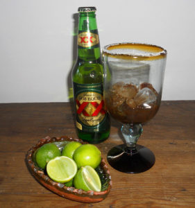 After salting the rim of the glass, add the spicy 'chirimico,' which consists of freshly squeezed lime juice, salt, Tabasco sauce, Worcestershire sauce, and "Jugo Maggi" — basically, an unsalted soy sauce sold all over Mexico. Add this to a Mexican lager, and it's is the best drink for the hot Mexican summer. © Daniel Wheeler, 2011