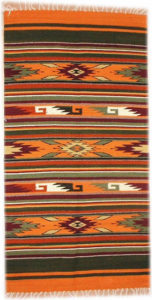 This handwoven Zapotec wool rug is a creation of the Santiago family of Teotitlan del Valle, Oaxaca. The motif is named "Mitla Diamond," for the intricate stonework on temples at the Mitla archeological site. © William Ing, 2007