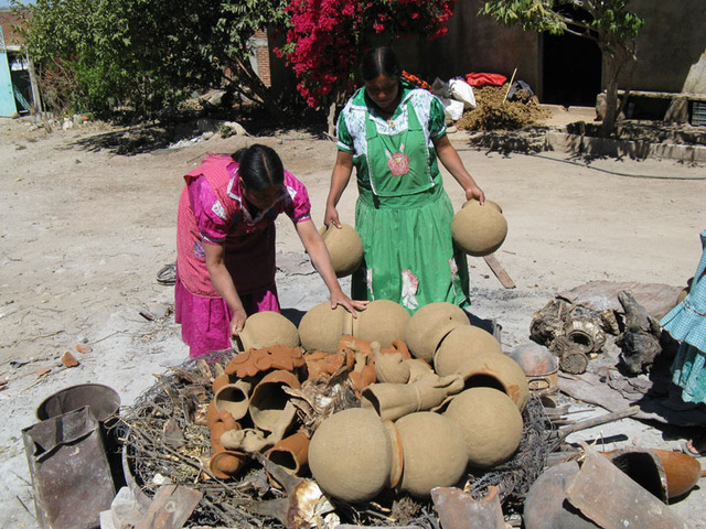 The women of San Marcos Tlapazola, Oaxaca, shape their clay pottery by hand. © Alvin Starkman, 2010