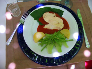 The main dish -- Oaxaca style mole amarillo -- tender slices of chicken breast atop a sea of aromatic deep saffron-colored mole, accompanied by a medley of crunchy-fresh steamed vegetables. © Alvin Starkman 2008