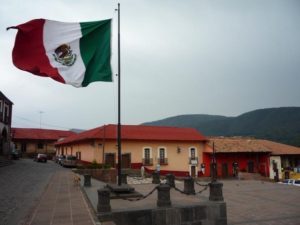 The Mexican flag flies doggedly over the township of Tlalpujahua, in an area lately battling the activities of the notorious "Family." The 19th century Dos Estrellas mine is located within the municipality of Tlalpujahua de Rayon in southern Michoacan. © Anthony Wright, 2009