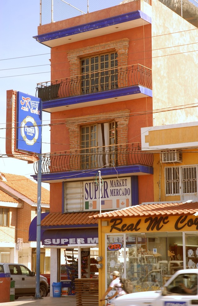 A typical building on Mazatlan's Camaron-Sabalo street has stores below and apartments above. © Gerry Soroka, 2009