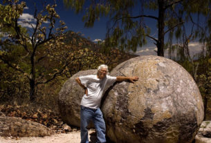 John Pint with one of the smaller Piedras Bola. Megaspherulites have been found in a few other places in the world, but none are as large as those near Ahualulco, Mexico, some of which are nearly 10 meters in diameter. © John Pint, 2009