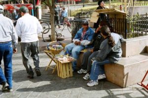 Vendors sell cigarettes, peanuts and cough drops from baskets in Plaza Manuel Acuña.